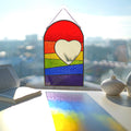 Stained glass rainbow heart suncatcher on windowsill casting rainbow reflections, mirror heart center, LGBT pride decor, 12.5x7.5 in
