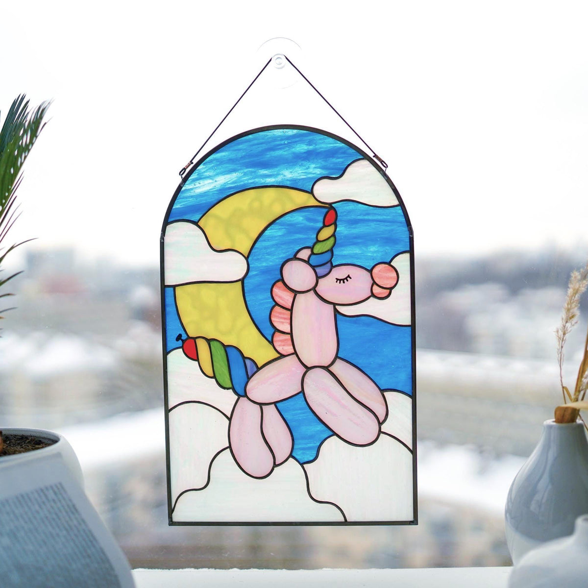Stained glass rainbow balloon unicorn panel with blue sky and yellow moon, arched zinc frame