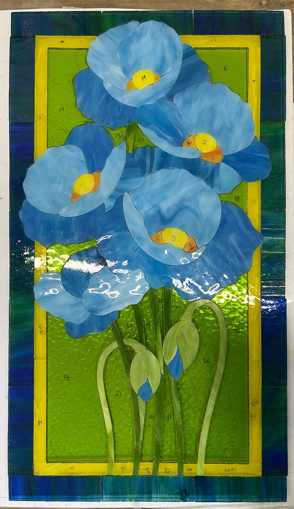 Stained glass floral panel with blue poppies on green background, Tiffany style, handmade in Ukraine