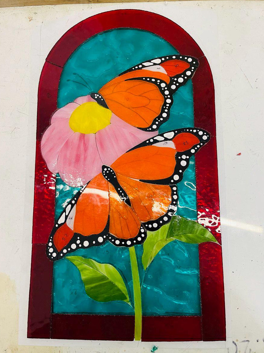 Glass pieces for handmade monarch butterfly stained glass panel, Tiffany copper foil technique in progress